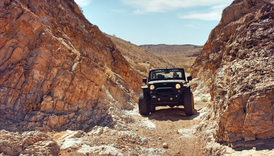 Jeep driving through the mountains