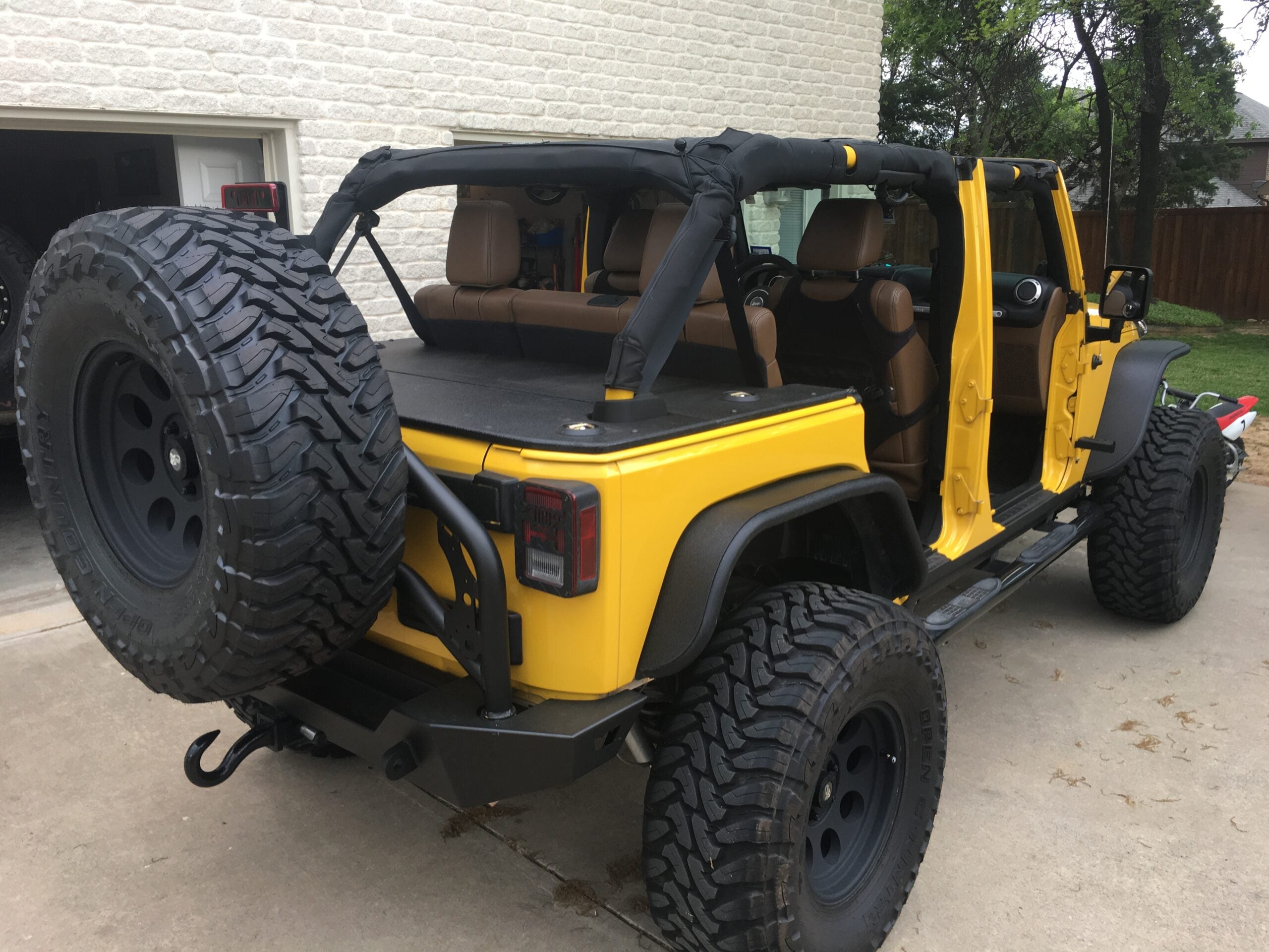 JKU Hardtop Cargo Security Cover on a yellow Jeep Wrangler