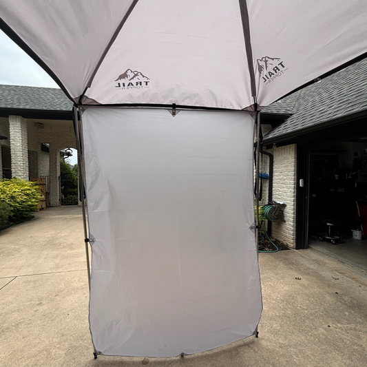 Detachable 5x7 Trail Topper side wall with branding in a driveway setting