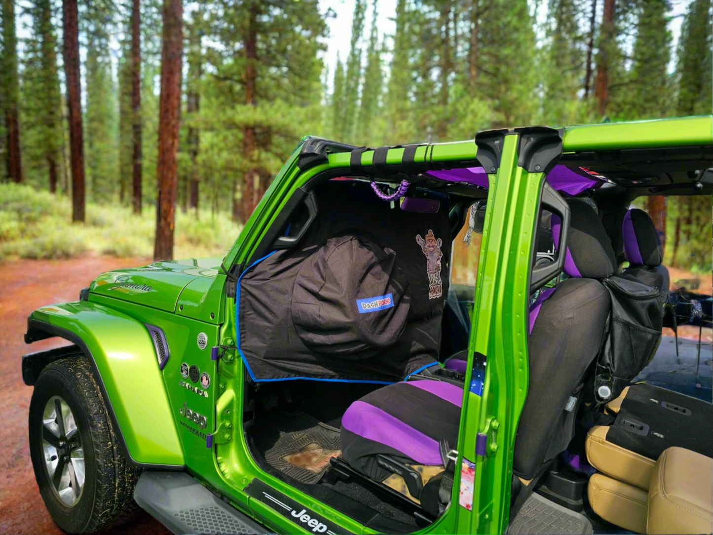 Green Mojto Wrangler Jeep with open doors in a forest setting and Dash Poncho Rain Protection cover 