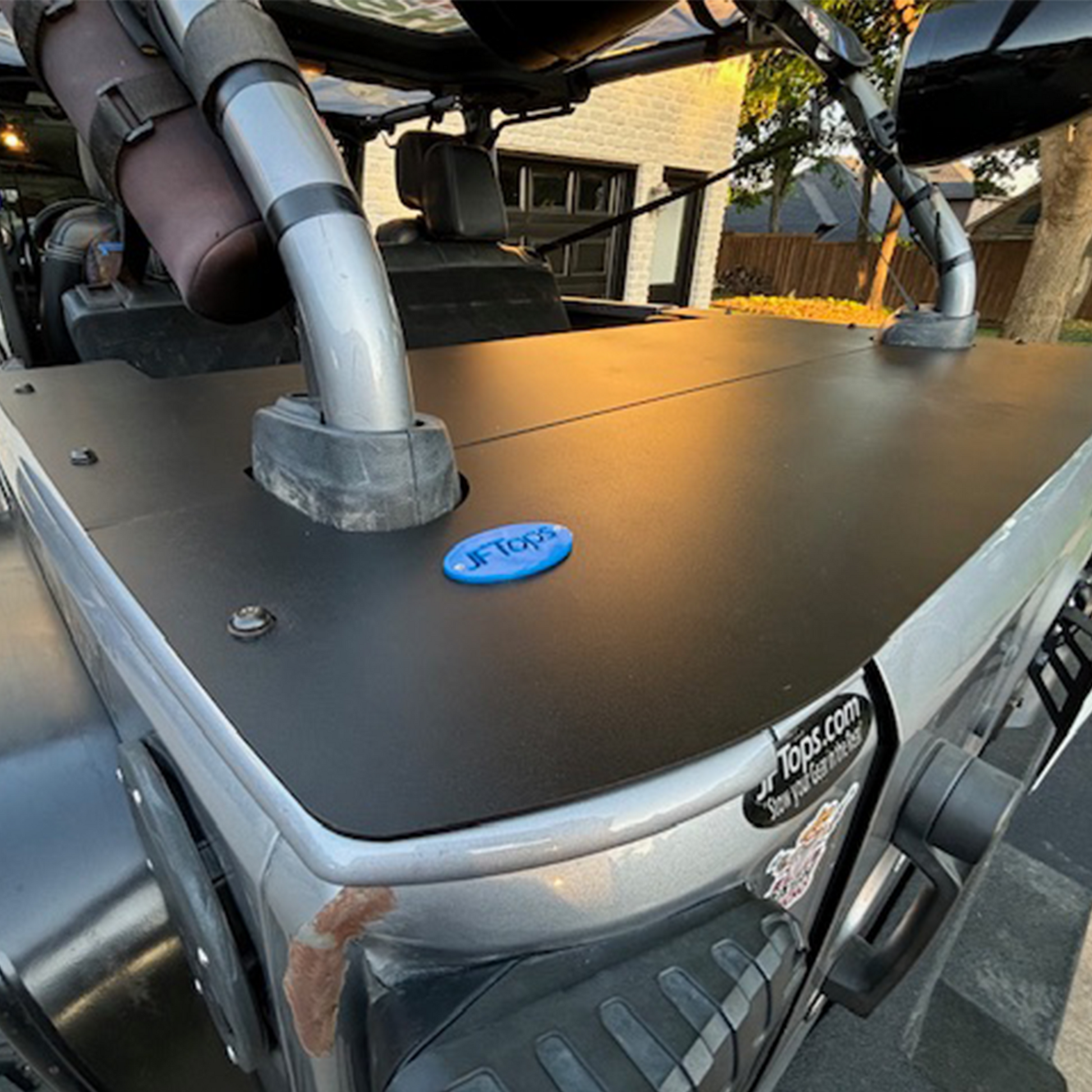 Close-up of a JKU cargo cover and nameplate blue decal with visible JFTops brand logo.