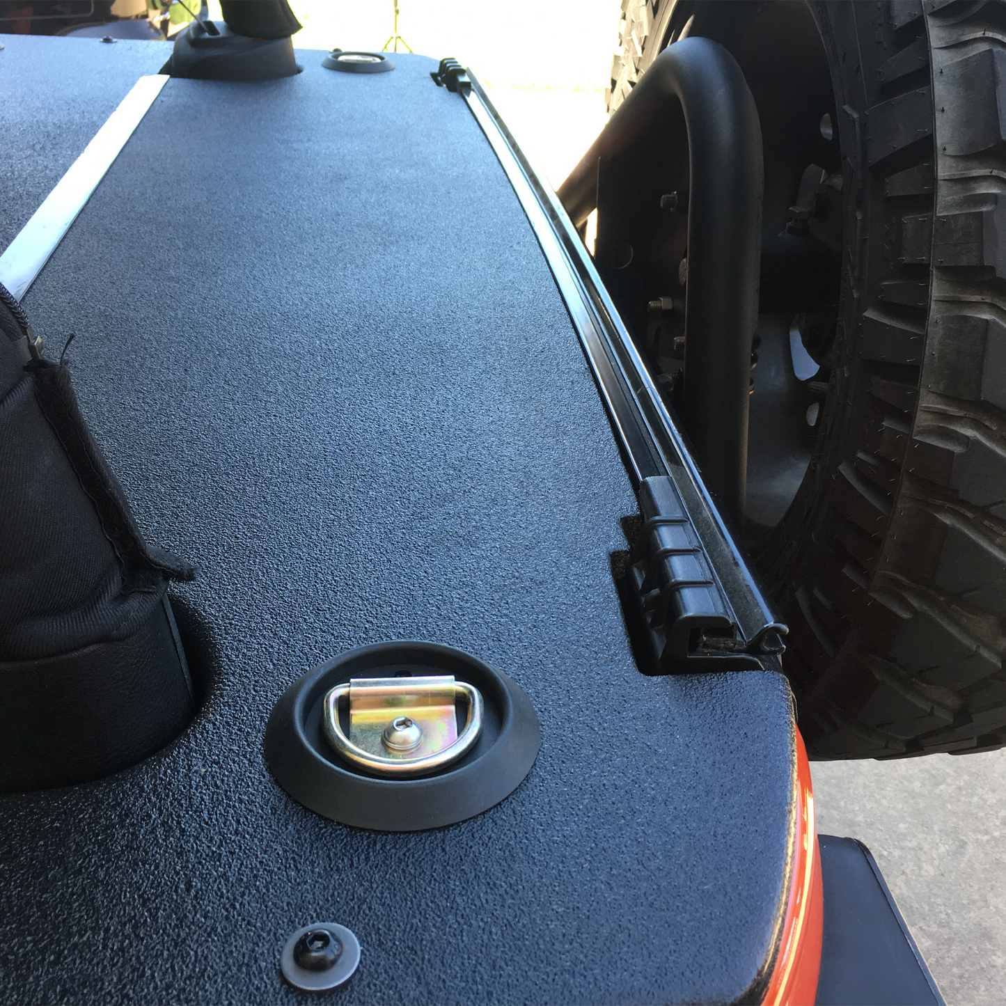 Close-up of a JKU Wrangler soft top cargo cover rhino-lined by JFTops