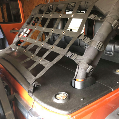 JKU hardtop cargo cover on orange jeep with net on back