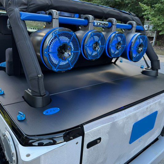 Sound system with blue speakers on Wrangler JKU Hard Top Aluminum cargo cover on open trunk space