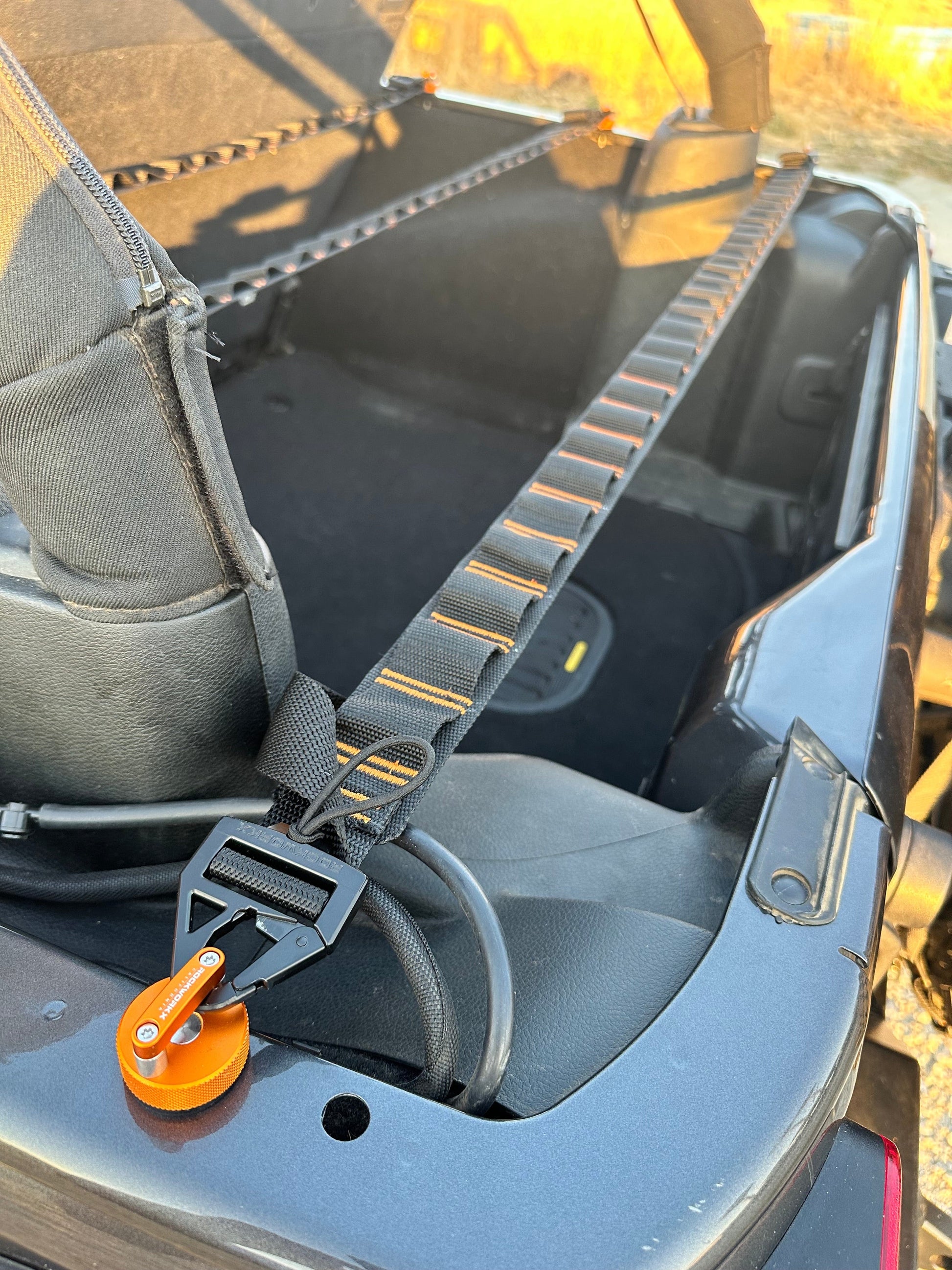Rockworkx 2 in tie-down strap with 1.5 in molle connector Orange thread